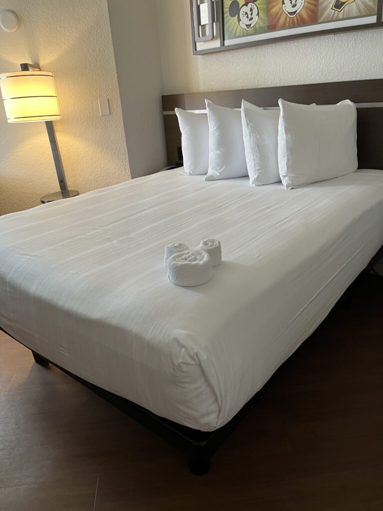 Queen Bed in Main Bedroom of the All-Star Music Family Suites